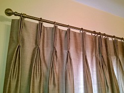 Linen look voiles in wave heading and roman blind